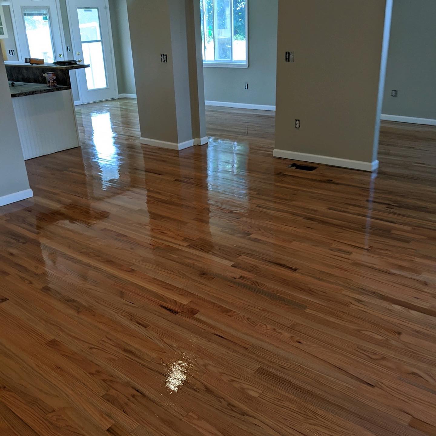 Large hardwood floor with finish applied